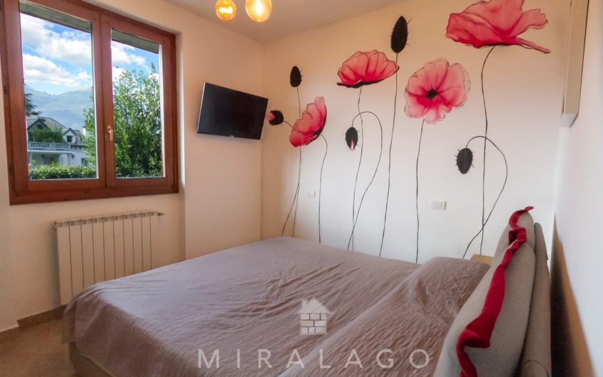 COLICO Trilocale con giardino, taverna e box